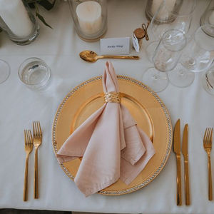Blush napkin place setting with gold cutlery