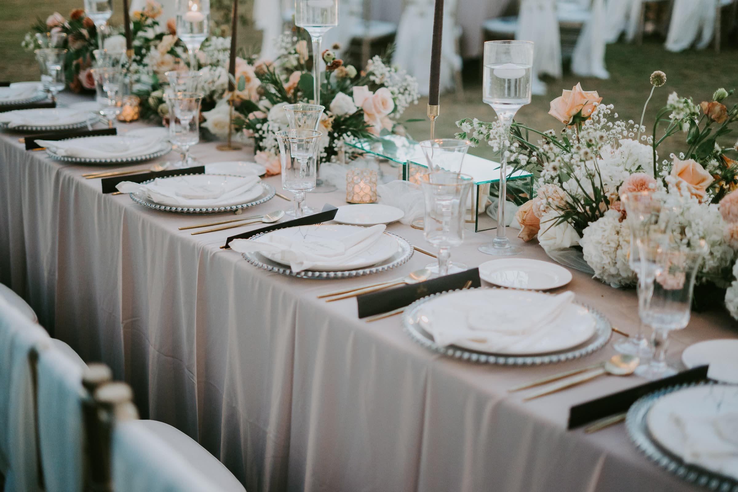 Candlelit table with white florals and glassware